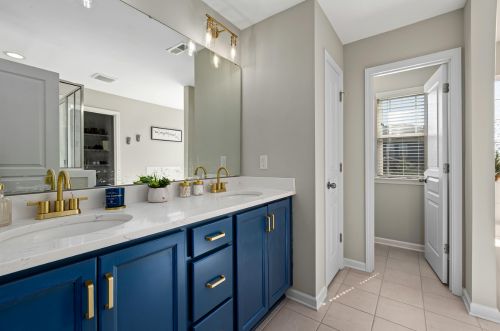 Bathroom remodeling with navy cabinets in Boca Raton FL